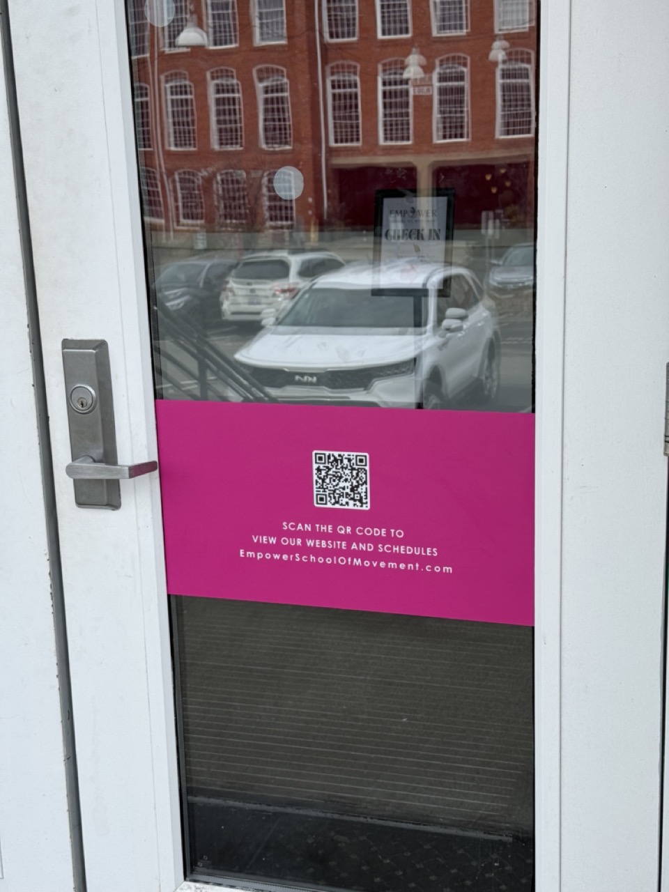 Magenta Empower School of Movement QR graphic applied to the studio entrance