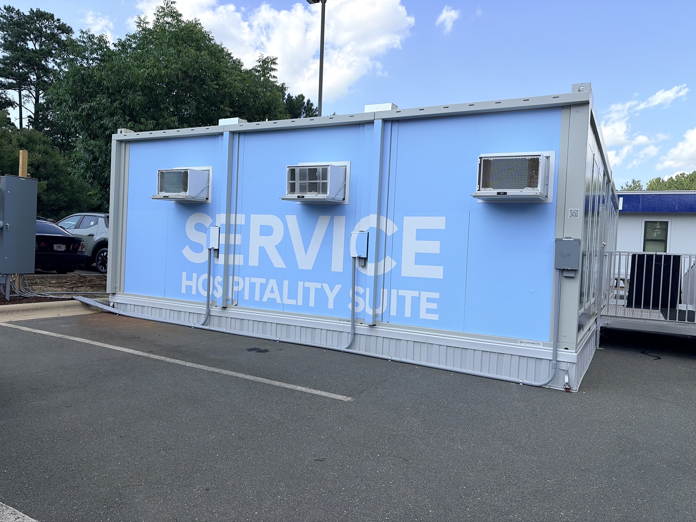 Finished blue Hyundai service hospitality suite side of the trailer