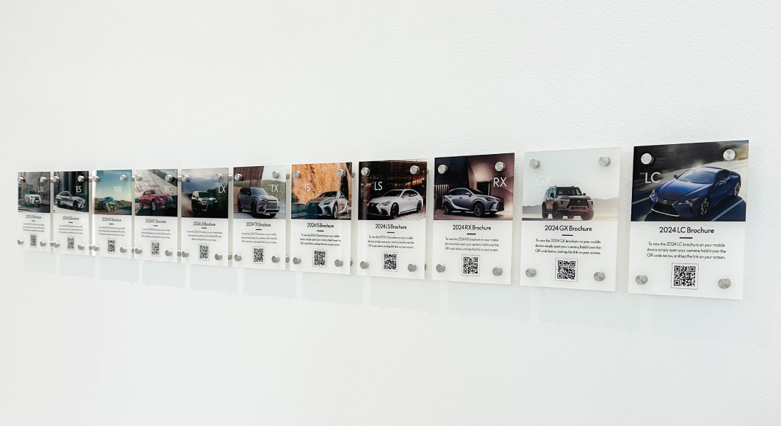 Full Lexus QR card lineup extending across the showroom wall
