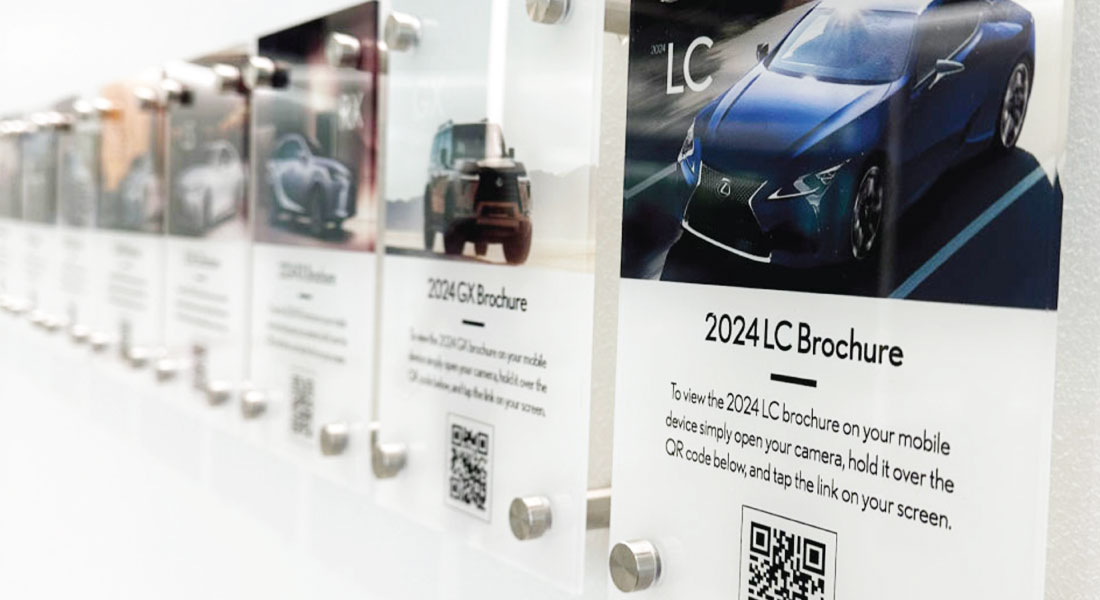 Close perspective of Lexus QR brochure cards with acrylic mounting hardware
