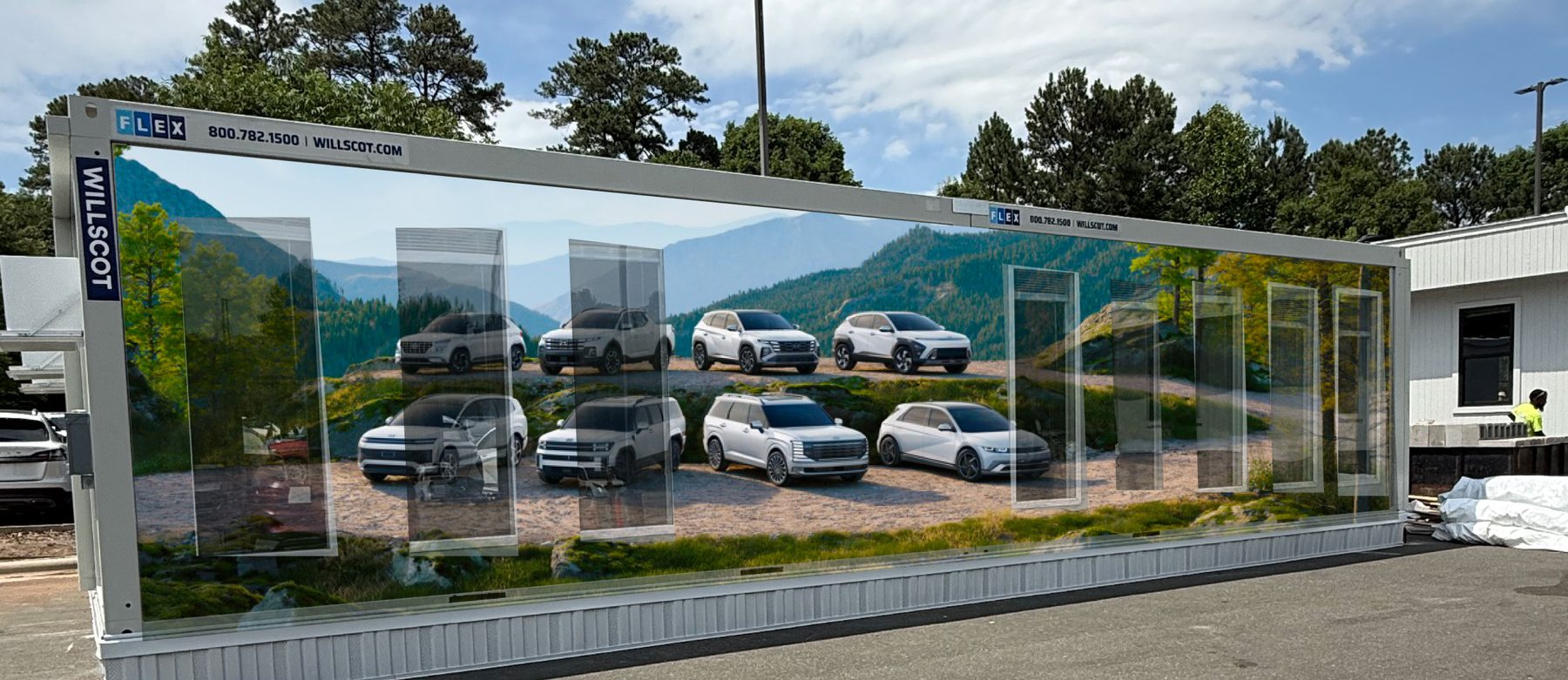 Hyundai dealership trailer wrapped with large-scale sales imagery